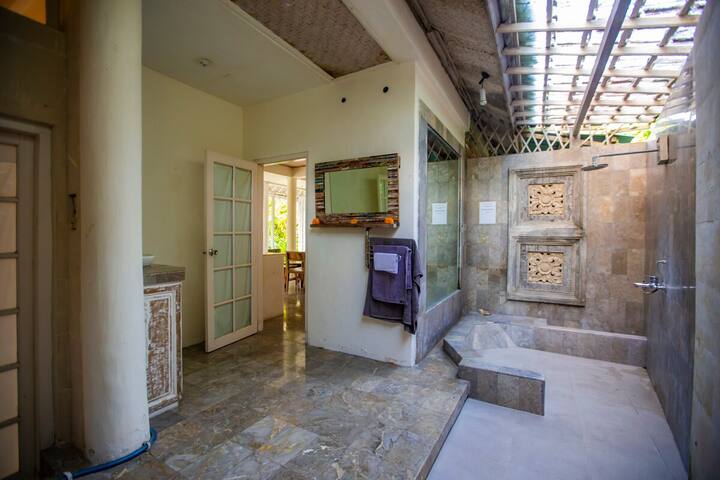 The stone bathroom on the lower level